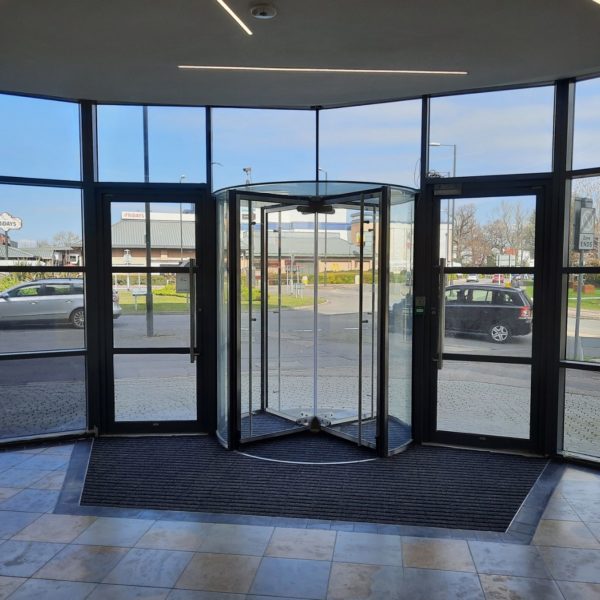 Automatic revolving door system in London